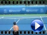 Janko Tipsarevic ("Tipsy") knocks over a tennis ball can